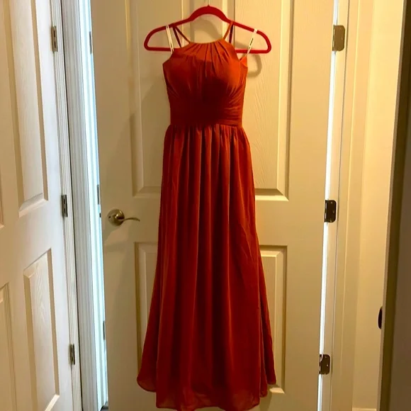 Elegant Rust color long gown. Very flowy and corset in the back. Never worn